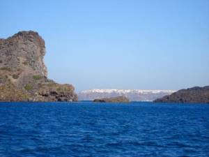 Volcanic plug with Thira town behind