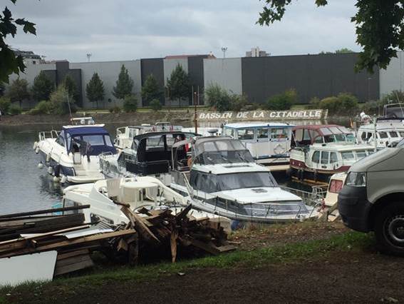 A boat parked in a parking lot

Description automatically generated