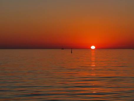 A picture containing water, outdoor, sunset, nature

Description automatically generated