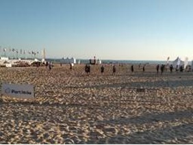 A group of people on a beach

Description automatically generated with medium confidence