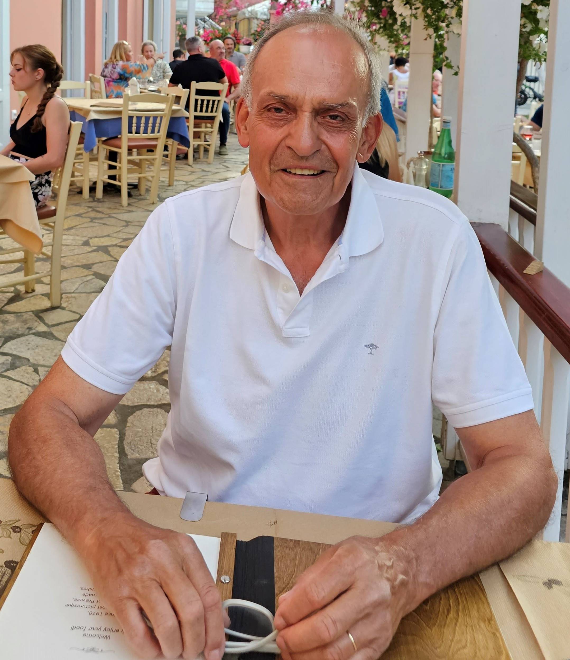 A person sitting at a table

Description automatically generated