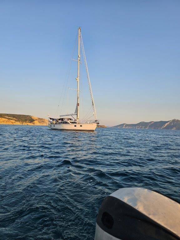 A sailboat in the water

Description automatically generated