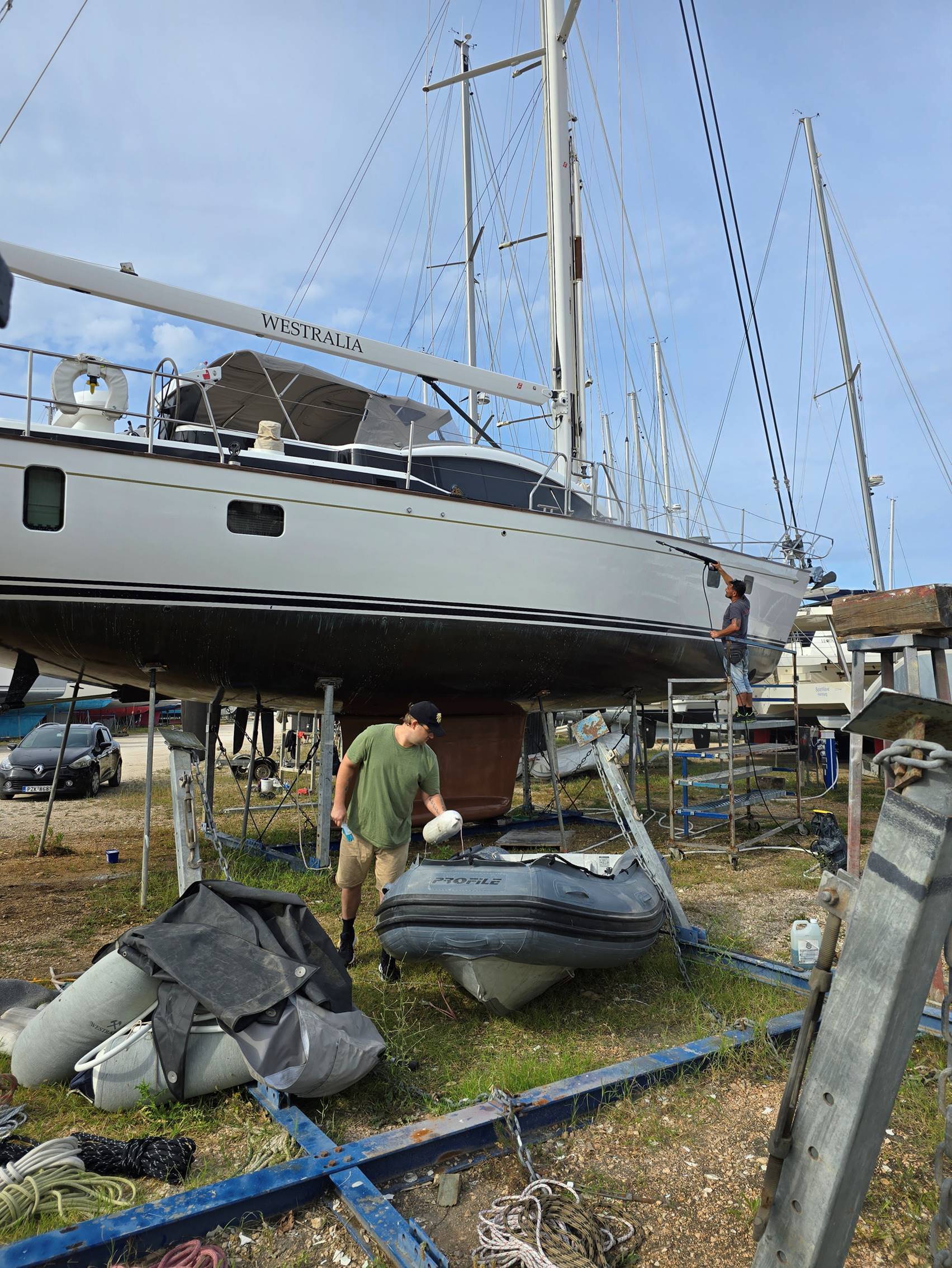 A person standing next to a boat

Description automatically generated