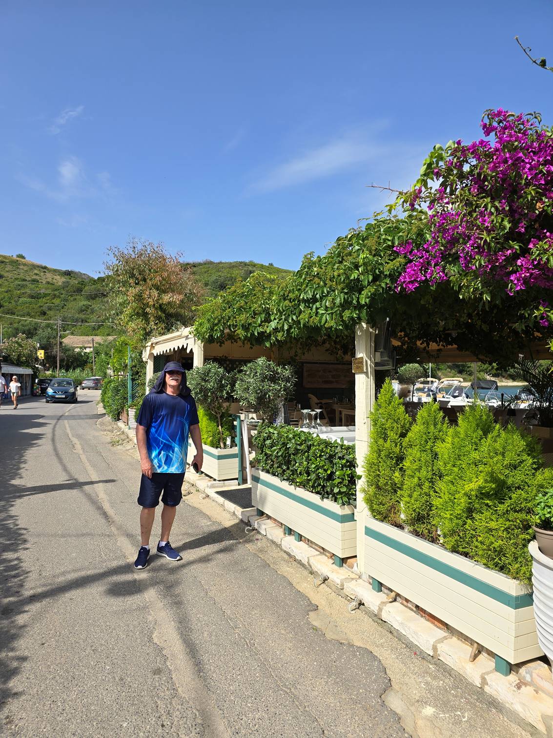 A person walking on a street

Description automatically generated