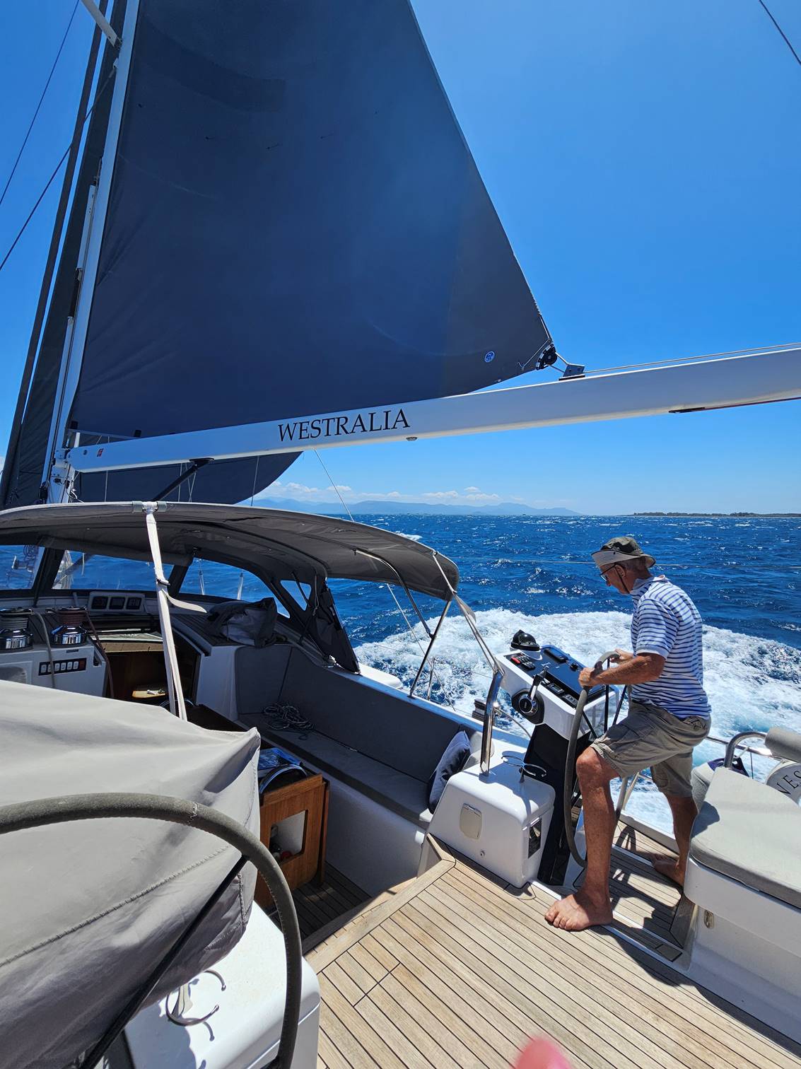 A person standing on a boat

Description automatically generated